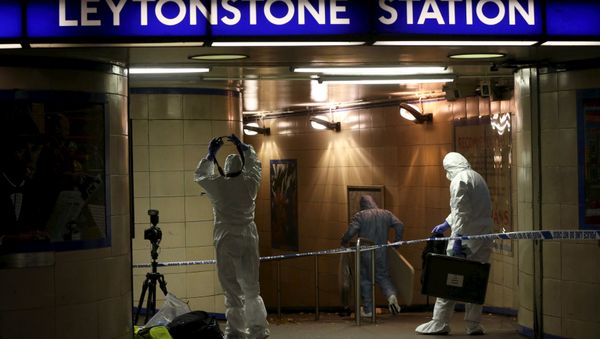Police officers investigate a crime scene at Leytonstone underground station in east London - Sputnik International