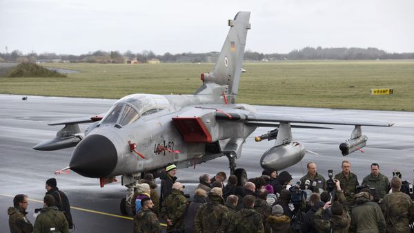 Journalists stand in front of a Tornado aircraft of the Tactical Air Force Wing 51 'Immelmann' during a presentation at German army Bundeswehr airbase in Jagel near the German-Danish border, December 4, 2015 Journalists stand in front of a Tornado aircraft of the Tactical Air Force Wing 51 'Immelmann' during a presentation at German army Bundeswehr airbase in Jagel near the German-Danish border, December 4, 2015 - Sputnik International