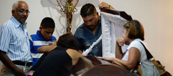 Family attend the funeral of the local leader of the Democratic Action party in Altagracia de Orituco, Luis Manuel Diaz, in the Altagracia de Orituco town in Guarico state, Venezuela, on November 26, 2015. Family attend the funeral of the local leader of the Democratic Action party in Altagracia de Orituco, Luis Manuel Diaz, in the Altagracia de Orituco town in Guarico state, Venezuela, on November 26, 2015. - Sputnik International