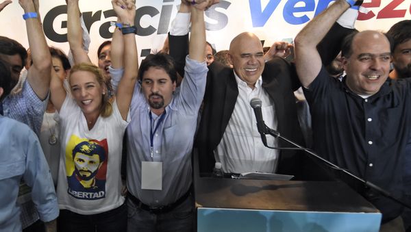 (L to R) The wife of jailed Venezuelan opposition leader Leopoldo Lopez, Lilian Tintori (C) Freddy Guevara, of the Voluntad Popular party, Jesus Torrealba, head of the Democratic Unity Movement (MUD) party and deputy Julio Borges celebrate after knowing the first results of the legislative election, at the MUD headquarters in Caracas, on the early morning December 7, 2015. (L to R) The wife of jailed Venezuelan opposition leader Leopoldo Lopez, Lilian Tintori (C) Freddy Guevara, of the Voluntad Popular party, Jesus Torrealba, head of the Democratic Unity Movement (MUD) party and deputy Julio Borges celebrate after knowing the first results of the legislative election, at the MUD headquarters in Caracas, on the early morning December 7, 2015. - Sputnik International