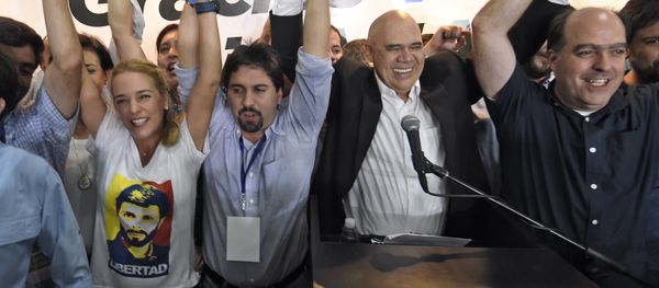 (L to R) The wife of jailed Venezuelan opposition leader Leopoldo Lopez, Lilian Tintori (C) Freddy Guevara, of the Voluntad Popular party, Jesus Torrealba, head of the Democratic Unity Movement (MUD) party and deputy Julio Borges celebrate after knowing the first results of the legislative election, at the MUD headquarters in Caracas, on the early morning December 7, 2015. (L to R) The wife of jailed Venezuelan opposition leader Leopoldo Lopez, Lilian Tintori (C) Freddy Guevara, of the Voluntad Popular party, Jesus Torrealba, head of the Democratic Unity Movement (MUD) party and deputy Julio Borges celebrate after knowing the first results of the legislative election, at the MUD headquarters in Caracas, on the early morning December 7, 2015. - Sputnik International