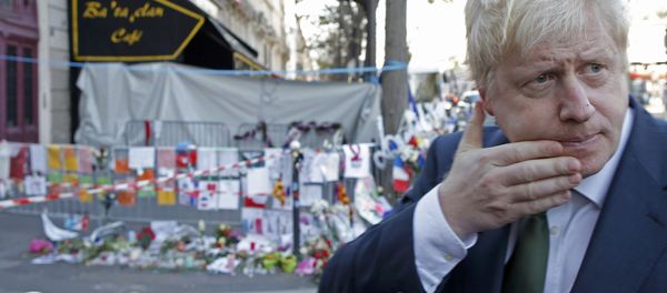 London Mayor Boris Johnson leaves after placing flowers at the Bataclan concert hall to pay tribute to the shooting victims in Paris, France, December 3, 2015. - Sputnik International