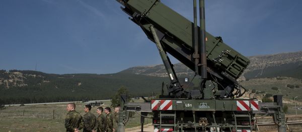 German soldiers stand to attention in front of a German Patriot missile launcher at the Gazi barracks in Kahramanmaras, southern Turkey on March 25, 2014 - Sputnik International