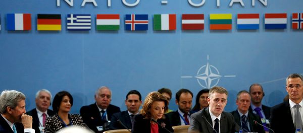 Montenegro's Foreign Minister Igor Luksic (at table, 2nd R) delivers remarks with Defense Minister Milica Pejanovic (3rd R) after Montenegro was welcomed as a new member at the NATO ministerial meetings at the NATO headquarters in Brussels December 2, 2015 Montenegro's Foreign Minister Igor Luksic (at table, 2nd R) delivers remarks with Defense Minister Milica Pejanovic (3rd R) after Montenegro was welcomed as a new member at the NATO ministerial meetings at the NATO headquarters in Brussels December 2, 2015 - Sputnik International