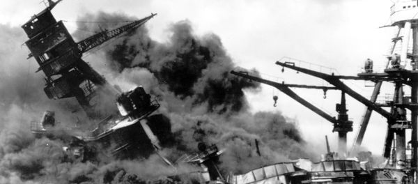 In this photo, the battleship USS Arizona belches smoke as it topples over into the sea during a Japanese surprise attack on Pearl Harbor, Hawaii, December 7, 1941. - Sputnik International