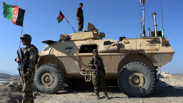 In this photograph taken on December 1, 2015, members of the Afghan security force keep watch during an ongoing operation against Islamic state (IS) groups in Achin district of Nangarhar province - Sputnik International
