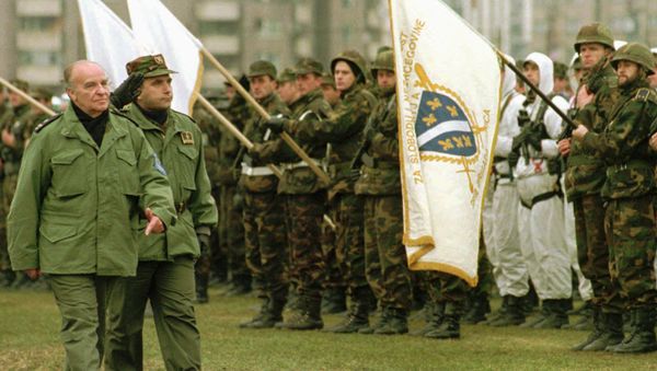 Bosnian President Alija Izetbegovic reviews troops during a military parade of the Bosnian Army in Zenica, 100 kilometres (62 miles) north of Sarajevo, Sunday December 10, 1995. Izetbegovic said that the Bosnian Army should be ready if something goes wrong during or after the NATO mandate to police the Dayton accord. At right is Bosnian Army Gen. Sakib Mahmuljin Bosnian President Alija Izetbegovic reviews troops during a military parade of the Bosnian Army in Zenica, 100 kilometres (62 miles) north of Sarajevo, Sunday December 10, 1995. Izetbegovic said that the Bosnian Army should be ready if something goes wrong during or after the NATO mandate to police the Dayton accord. At right is Bosnian Army Gen. Sakib Mahmuljin - Sputnik International