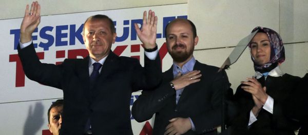 Turkey's Prime Minister Recep Tayyip Erdogan, his son Bilal Erdogan and daughter Sumeyye Erdogan salute supporters from the balcony of his ruling party headquarters in Ankara. - Sputnik International