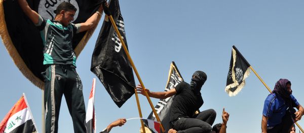 FILE - Masked Sunni protesters wave Islamist flags while others chant slogans at an anti-government rally in Fallujah, Iraq FILE - Masked Sunni protesters wave Islamist flags while others chant slogans at an anti-government rally in Fallujah, Iraq - Sputnik International