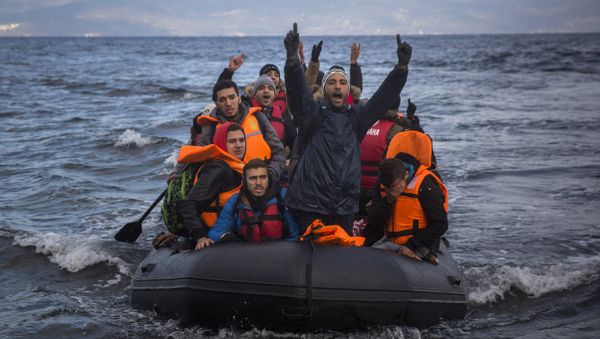 Migrants and refugees react as they arrive on a dinghy from the Turkish coast to the northeastern Greek island of Lesbos on Wednesday, Dec. 9, 2015. Migrants and refugees react as they arrive on a dinghy from the Turkish coast to the northeastern Greek island of Lesbos on Wednesday, Dec. 9, 2015. - Sputnik International