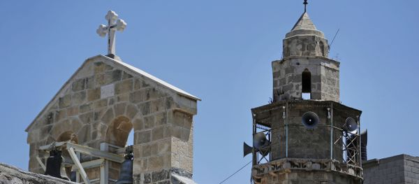 The bell tower of St. Porphyrios Greek Orthodox church, left, and the minaret of the adjacent Kateb Welaya mosque, right, are seen in Gaza City, Sunday, Aug. 10, 2014 The bell tower of St. Porphyrios Greek Orthodox church, left, and the minaret of the adjacent Kateb Welaya mosque, right, are seen in Gaza City, Sunday, Aug. 10, 2014 - Sputnik International