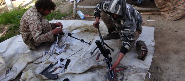 In this file photo released on June 16, 2015, by Ismamic State militant group supporters on an anonymous photo sharing website, Islamic State militants clean their weapons in Deir el-Zour city, Syria - Sputnik International