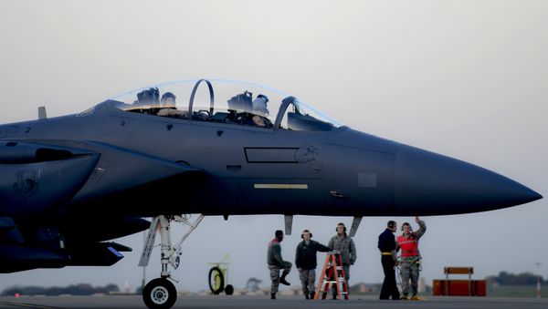 In this image released by the US Air Force (USAF), an F-15E Strike Eagle prepares to depart RAF Lakenheath in the United Kingdom to support Operation Inherent Resolve, on November 12, 2015 - Sputnik International