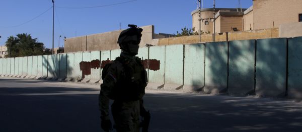 A member from Iraqi security forces walks past the Turkish embassy in Baghdad December 8 2015 A member from Iraqi security forces walks past the Turkish embassy in Baghdad December 8 2015 - Sputnik International
