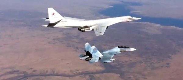 Russian Aerospace Defense Forces' Su-30SM fighter escorts a Tu-160 bomber Russian Aerospace Defense Forces' Su-30SM fighter escorts a Tu-160 bomber - Sputnik International