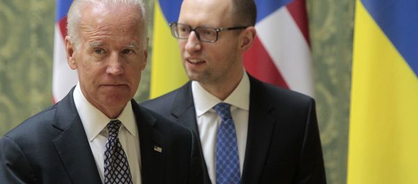 US Vice President Joe Biden, left, and Ukrainian Prime Minister Arseniy Yatsenyuk leave after delivering a joint statement to the press in Kiev, Ukraine, Tuesday, April 22, 2014. - Sputnik International
