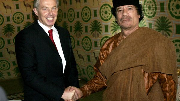 In this Tuesday May 29, 2007 file photo Britain's Prime Minister Tony Blair, left, meets Libyan leader Moammar Gadhafi, at his desert base outside Sirte south of Tripoli. - Sputnik International