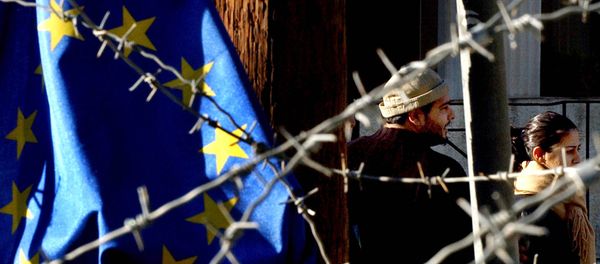 Turkish Cypriot couple, seen behind barbed wire and an EU flag, as they cross the Ledra Palace checkpoint in Nicosia, Cyprus (File) - Sputnik International