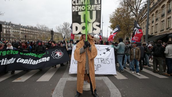 A protestor dressed in reference to Star Wars stands before a banner reading Defend the climate and democracy, you must during a rally against global warming on November 29, 2015 in Paris, a day ahead of the start of UN conference on climate change COP21 A protestor dressed in reference to Star Wars stands before a banner reading Defend the climate and democracy, you must during a rally against global warming on November 29, 2015 in Paris, a day ahead of the start of UN conference on climate change COP21 - Sputnik International