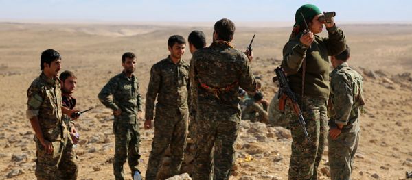 A group of coalition forces, which includes People's Protection Units (YPG) Women's Protection Units (YPJ), Sutoro militia, a pro-government Syriac Christian movement, and other forces, monitor the area in al-Hol in the Syrian Hasakeh province, some 650 kms northeast of Damascus, near the Iraqi border on November 2, 2015 A group of coalition forces, which includes People's Protection Units (YPG) Women's Protection Units (YPJ), Sutoro militia, a pro-government Syriac Christian movement, and other forces, monitor the area in al-Hol in the Syrian Hasakeh province, some 650 kms northeast of Damascus, near the Iraqi border on November 2, 2015 - Sputnik International