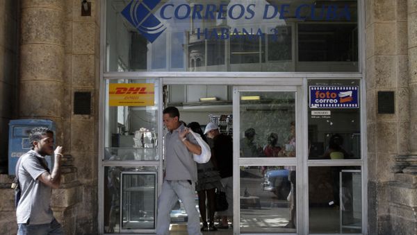 A man leaves a postal office in Havana, Cuba - Sputnik International