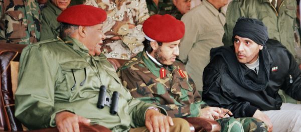 In this undated file photo made available Sunday, Sept. 25, 2011, al-Saadi Gadhafi, center, and Hannibal Gadhafi, right, sons of Libyan leader Moammar Gadhafi, are seen in the audience at a military exercise by the elite military unit commanded by their brother, Khamis, in Zlitan - 90 miles (140 kilometers) southeast of Tripoli, Libya. In this undated file photo made available Sunday, Sept. 25, 2011, al-Saadi Gadhafi, center, and Hannibal Gadhafi, right, sons of Libyan leader Moammar Gadhafi, are seen in the audience at a military exercise by the elite military unit commanded by their brother, Khamis, in Zlitan - 90 miles (140 kilometers) southeast of Tripoli, Libya. - Sputnik International
