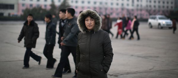 A North Korean woman walks down the streets of Pyongyang, North Korea on Tuesday, Dec. 1, 2015 where the winter season has started A North Korean woman walks down the streets of Pyongyang, North Korea on Tuesday, Dec. 1, 2015 where the winter season has started - Sputnik International