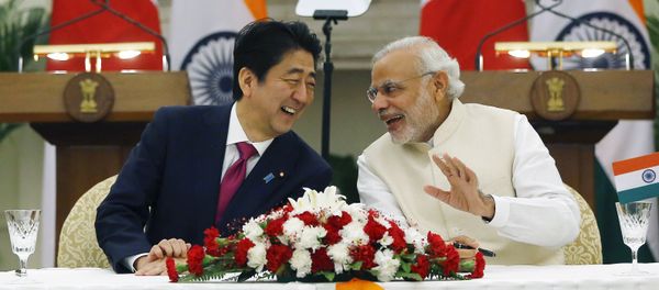 Japan's Prime Minister Shinzo Abe (L) and his Indian counterpart Narendra Modi shares a moment during a signing of agreement at Hyderabad House in New Delhi, India, December 12, 2015 Japan's Prime Minister Shinzo Abe (L) and his Indian counterpart Narendra Modi shares a moment during a signing of agreement at Hyderabad House in New Delhi, India, December 12, 2015 - Sputnik International