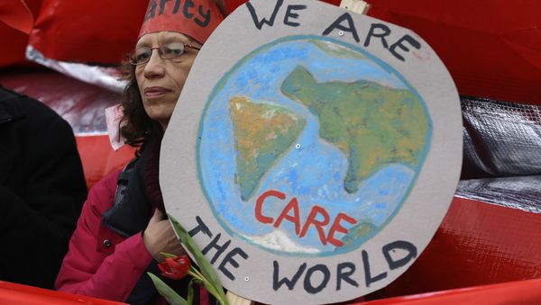 A climate activist demonstrates in Paris, Saturday, Dec.12, 2015 during the COP21, the United Nations Climate Change Conference. - Sputnik International