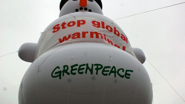 An inflatable snow man conveying Stop Global Warming! at the G8 (2007). Greenpeace - Sputnik International