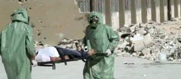 FILE - This image made from an AP video posted on Wednesday, Sept. 18, 2013 shows shows Syrians in protective suits and gas masks conducting a drill on how to treat casualties of a chemical weapons attack in Aleppo, Syria. The Islamic State group is aggressively pursuing development of chemical weapons, setting up a branch dedicated to research and experiments with the help of scientists from Iraq, Syria and elsewhere in the region, according to Iraqi and U.S. intelligence officials. (AP Photo via AP video, File) FILE - This image made from an AP video posted on Wednesday, Sept. 18, 2013 shows shows Syrians in protective suits and gas masks conducting a drill on how to treat casualties of a chemical weapons attack in Aleppo, Syria. The Islamic State group is aggressively pursuing development of chemical weapons, setting up a branch dedicated to research and experiments with the help of scientists from Iraq, Syria and elsewhere in the region, according to Iraqi and U.S. intelligence officials. (AP Photo via AP video, File) - Sputnik International