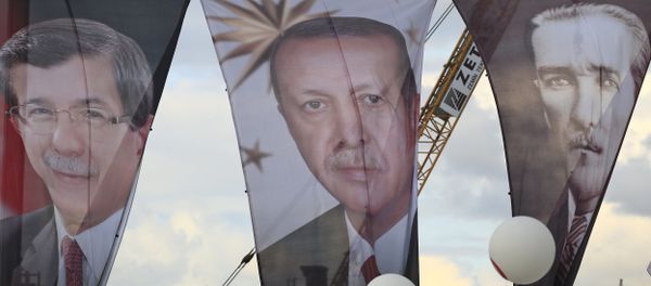 Banners from left to right show Turkish Prime Minister Ahmet Davutoglu, also leader of the Justice and Development Party (AKP); Turkey's current President Recep Tayyip Erdogan' and Turkish Republic founder Mustafa Kemal Ataturk Banners from left to right show Turkish Prime Minister Ahmet Davutoglu, also leader of the Justice and Development Party (AKP); Turkey's current President Recep Tayyip Erdogan' and Turkish Republic founder Mustafa Kemal Ataturk - Sputnik International