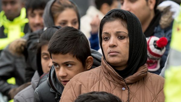 Migrants wait for registration at the Hesse state Initial Reception Center in Giessen, Germany, Wednesday Dec. 2, 2015. - Sputnik International