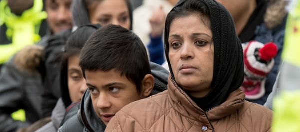 Migrants wait for registration at the Hesse state Initial Reception Center in Giessen, Germany, Wednesday Dec. 2, 2015. - Sputnik International
