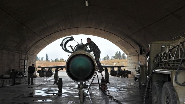 MiG-21 aircraft of the Syrian Air Force gets ready for a mission at the Hama airbase near the city of Hama, Syria's Hama Province MiG-21 aircraft of the Syrian Air Force gets ready for a mission at the Hama airbase near the city of Hama, Syria's Hama Province - Sputnik International