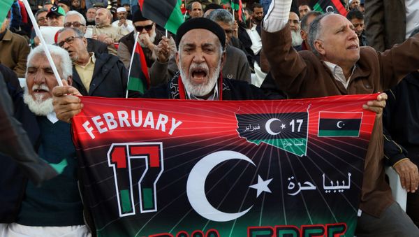 Libyan protesters shout slogans during a demonstration against a UN-sponsored agreement on forming a national unity government, on December 11, 2015 in the capital Tripoli. Libyan protesters shout slogans during a demonstration against a UN-sponsored agreement on forming a national unity government, on December 11, 2015 in the capital Tripoli. - Sputnik International