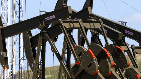 This June 12, 2014 file photo shows four pumps at an oil production facility in Watford City, N.D. - Sputnik International