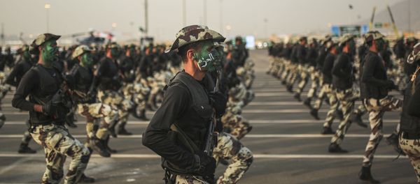 In this Thursday, Sept. 17, 2015 file photo, Saudi security forces, whose faces display the word Decisive take part in a military parade. In this Thursday, Sept. 17, 2015 file photo, Saudi security forces, whose faces display the word Decisive take part in a military parade. - Sputnik International