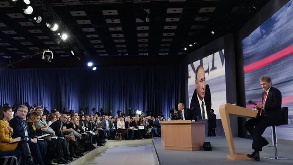 December 17, 2015. Russian President Vladimir Putin at the 11th annual news conference at the World Trade Center on Krasnaya Presnya. Right: Presidential Press Secretary Dmitry Peskov - Sputnik International