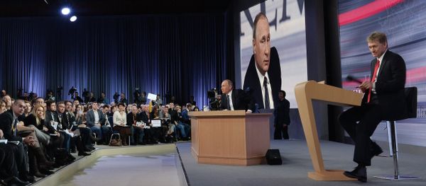 December 17, 2015. Russian President Vladimir Putin at the 11th annual news conference at the World Trade Center on Krasnaya Presnya. Right: Presidential Press Secretary Dmitry Peskov - Sputnik International