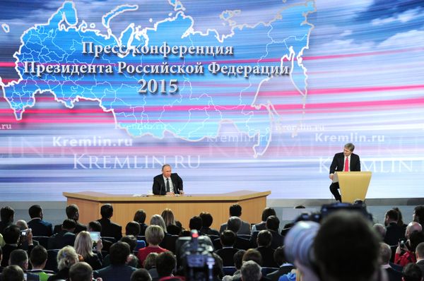 Russian President Vladimir Putin, left, at the 11th annual news conference at the World Trade Center on Krasnaya Presnya. Russian President Vladimir Putin, left, at the 11th annual news conference at the World Trade Center on Krasnaya Presnya. - Sputnik International