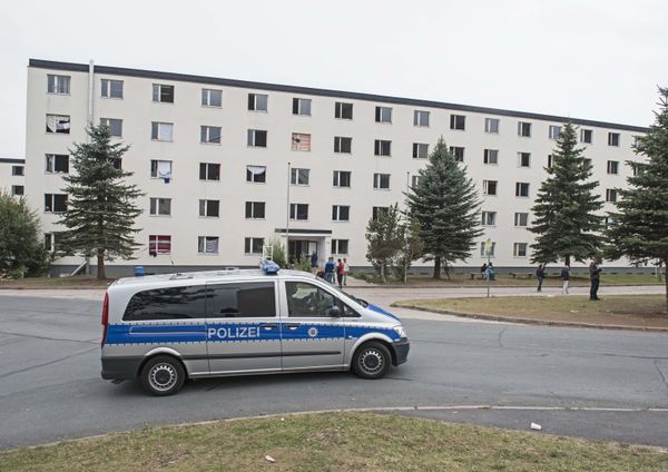 In this Thursday, Aug. 20, 2015 file photo, a police car patrols in front of the refugee home in Suhl, central Germany In this Thursday, Aug. 20, 2015 file photo, a police car patrols in front of the refugee home in Suhl, central Germany - Sputnik International