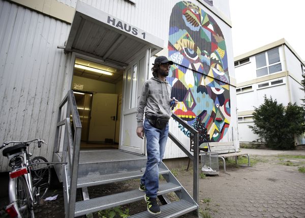 Mohamed Shmer, 24, a refugee from Syria, leaves house 1 at a camp for refugees and migrants in Berlin, Germany, Friday, Sept. 11, 2015 Mohamed Shmer, 24, a refugee from Syria, leaves house 1 at a camp for refugees and migrants in Berlin, Germany, Friday, Sept. 11, 2015 - Sputnik International