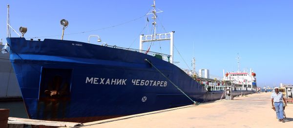 A picture taken on September 17, 2015 shows a Russian flagged oil tanker after it was caught in Libyan waters without permission and brought to Tripoli’s maritime base by Libyan coastal authorities for investigation as they believed the Russian crew were smuggling fuel from the port of Zuwarah, some 160 kilometres from the capital - Sputnik International