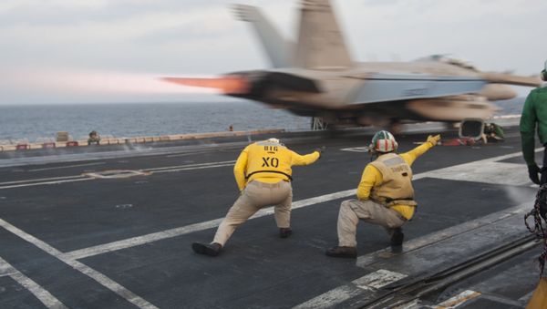 US Navy handout photo, flight deck crew launch an EA-18G Growler from the Nimitz-class aircraft carrier USS Carl Vinson (CVN 70) (File) - Sputnik International
