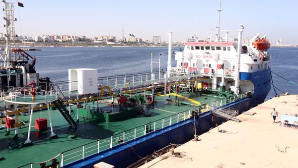 A picture taken on September 17, 2015 shows a Russian flagged oil tanker after it was caught in Libyan waters without permission and brought to Tripoli’s maritime base by Libyan coastal authorities for investigation as they believed the Russian crew were smuggling fuel from the port of Zuwarah, some 160 kilometres from the capital - Sputnik International