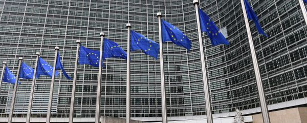 European flags flutter in front of the European Commission building as the European Commission President-elect unveils the list of the new European Commissioners during a press conference in Brussels, on September 10, 2014 European flags flutter in front of the European Commission building as the European Commission President-elect unveils the list of the new European Commissioners during a press conference in Brussels, on September 10, 2014 - Sputnik International