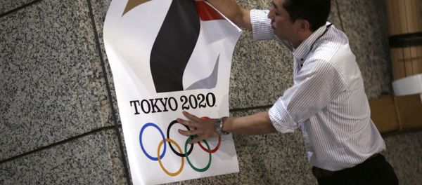 The poster with a logo of Tokyo Olympic Games 2020 is removed from the wall by a worker during an event staged for photographers at the Tokyo Metropolitan Government building in Tokyo Tuesday, Sept. 1, 2015 The poster with a logo of Tokyo Olympic Games 2020 is removed from the wall by a worker during an event staged for photographers at the Tokyo Metropolitan Government building in Tokyo Tuesday, Sept. 1, 2015 - Sputnik International