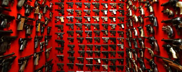 In this file photo, guns line the walls of the firearms reference collection at the Washington Metropolitan Police Department headquarters in Washington on Friday, Sept. 28, 2007 - Sputnik International