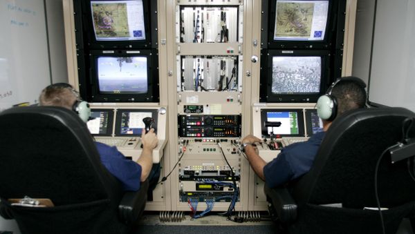 CBP Air and Marine officers control and watch images taken by Unmanned aerial vehicles (drones) of the CBP. This surveillance provides information concerning illegal activities taking place in remote areas to Border Patrol agents. - Sputnik International